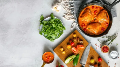 Chicken korma with vegetables on the table